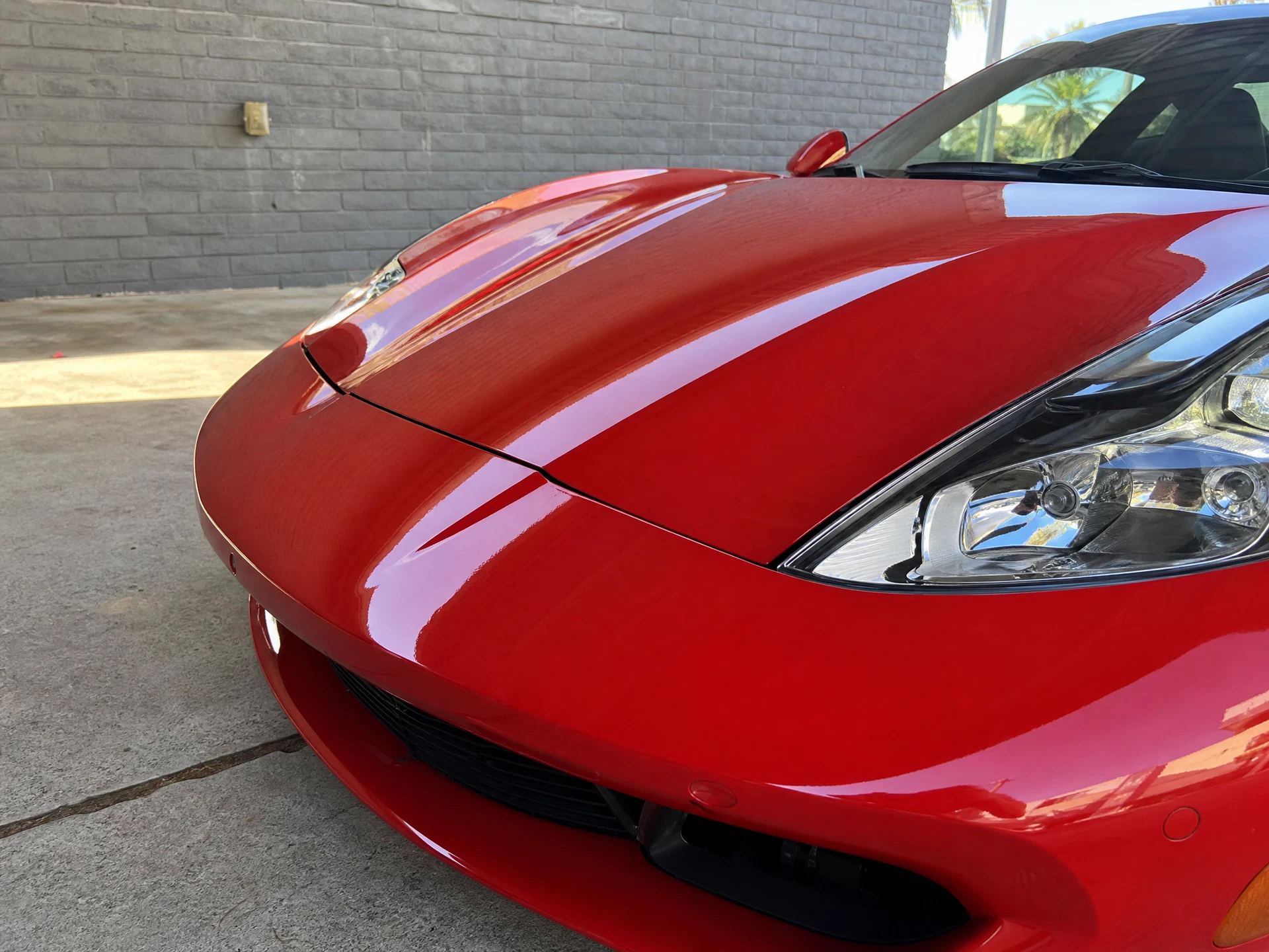 Refined red vehicle finish after paint care
